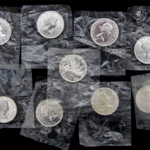 לוט של 9 מטבעות כסף קנדיים ישנים משנת 1962, (דולר קנדי).