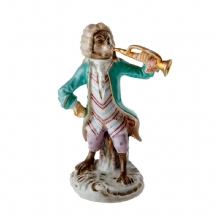 פסלון פורצלן עתיק בדמות קוף מנגן