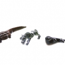 לוט של ארבעה פסלי חיות (טיגריס, תנין, כלב ים וברבור)