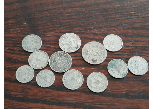 לוט של 12 מטבעות עות'מאניים מהשנים 1909, 1918, של: 5 פארה, 10 פארה ו-20 פארה.