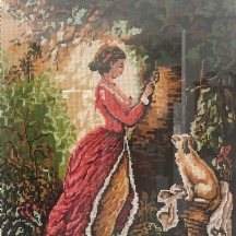 ריקמה ישנה (גובלן) עבודת יד המתארת אישה וכלב, על פי הציור הנודע 'The Souvenir'