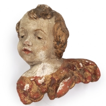 מסכת קיר עתיקה בדמות ראש מלאך (פוטי), עשויה טרקוטה מצויירת ומוזהבת, לא חתום